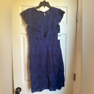 Adorable, NWT navy blue dress with ruffles, eyelet design and tie in back